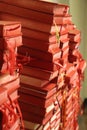 Leaning stacks of red hymnals