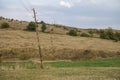 Leaning wooden electrical poles with wires 2 Royalty Free Stock Photo