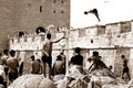 Leap of Freedom: Moroccan Youth Diving from a Wall