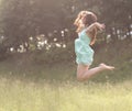 Leap in the sky.enthusiastic young woman enjoying freedom Royalty Free Stock Photo