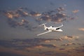 Learjet 45 with Sunset Clouds Royalty Free Stock Photo