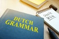 Learn dutch grammar. Book on a table.