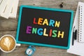 Learn English advice with colourful letters on chalkboard