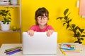 Learn English concept with kids, girl using her laptop. Kid using laptop watching online e-learning video Royalty Free Stock Photo