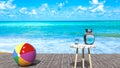 Holiday relax - summer sea relaxing outdoors scene, sunny day, beach ball, blue ocean, peaceful sky with puffy clouds Royalty Free Stock Photo