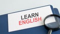 learn english words on paper and magnifying lens Royalty Free Stock Photo