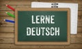 Learn German language, chalk on green board, education concept Royalty Free Stock Photo