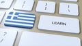 Learn Greek Language Concept. Online Study Courses. Button with Text on Keyboard. 3D Illustration Royalty Free Stock Photo