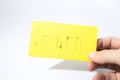 Learn handwrite with a hand on a yellow paper