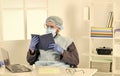 Learn how protect yourself. Man reading book. Medical research. Worker in protective equipment. Doctor studying Royalty Free Stock Photo