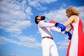 Learn how to defend yourself. Man and woman boxing gloves fight sky background. Couple boxing painful face suffer