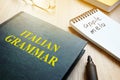 Learn italian grammar. Book on a table. Royalty Free Stock Photo