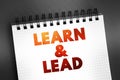 Learn and Lead - helps new managers make the transition from individual contributors to effective leaders, text concept on notepad Royalty Free Stock Photo