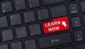 Learn Now On Red Keyboard Button. Learn Now With Arrow Icon On Red Keyboard Button. Royalty Free Stock Photo