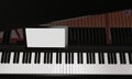 Learn piano online by yourself. Use a tablet or computer to learn piano tutorials online. The black grand piano has a tablet