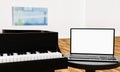 Learn piano online by yourself. Use a tablet or computer to learn piano tutorials online. The black grand piano has a tablet