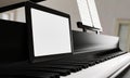 Learn piano online by yourself. Use a tablet or computer to learn piano tutorials online. The black grand piano has a tablet