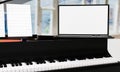 Learn piano online by yourself. Use a tablet or computer to learn piano tutorials online. The black grand piano has a tablet