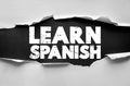 LEARN SPANISH bold text on ripped paper background concept, language education banner, study headline, international communication Royalty Free Stock Photo