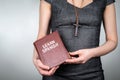 Learn Spanish concept. Woman holding a textbook Royalty Free Stock Photo