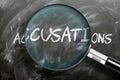 Learn, study and inspect accusations - pictured as a magnifying glass enlarging word accusations, symbolizes researching, Royalty Free Stock Photo