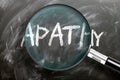 Learn, study and inspect apathy - pictured as a magnifying glass enlarging word apathy, symbolizes researching, exploring and Royalty Free Stock Photo