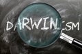 Learn, study and inspect darwinism - pictured as a magnifying glass enlarging word darwinism, symbolizes researching, exploring Royalty Free Stock Photo