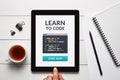 Learn to code concept on tablet screen