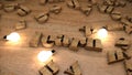 Learn word from wooden cubes, wood letters text string on table with light bulbs Royalty Free Stock Photo