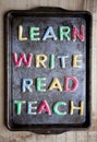 Learn Write Read and Teach cookies on baking tray Royalty Free Stock Photo