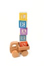 Learn written with play blocks on wooden toy truck Royalty Free Stock Photo