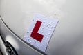 Learner driver plate on the front of white car Royalty Free Stock Photo