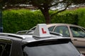 A learner driver sign on the roof of the car of a driving school Royalty Free Stock Photo
