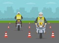 Learner motorcyclists practising to ride a moto. Back and front view of a learner bikers on test road with red cones. Royalty Free Stock Photo