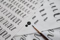 Learning calligraphy - paper with example and brush and ink Royalty Free Stock Photo