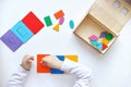 Learning colors and shapes. Children's wooden toy. The child collects a sorter. Educational logic toys for kid's.