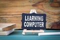 Learning Computer, education concept. small wooden board with chalk on the table Royalty Free Stock Photo