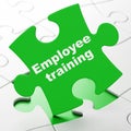 Learning concept: Employee Training on puzzle background