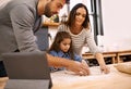 Learning, cooking and family in kitchen with tablet for recipe, guide and mom and dad with child in home. Baking, pizza Royalty Free Stock Photo