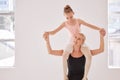 Learning, development and ballet teacher with her student, having fun and being playful in a studio. Young caring