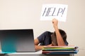 Learning difficulties, school, education, online remote learning concept. Sad kid with laptop computer holding card with Royalty Free Stock Photo