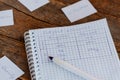 Learning English grammar. A notebook, a pen, paper cards with English words on a wooden table. Studying subject pronouns lesson