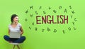 Learning English theme with young woman Royalty Free Stock Photo