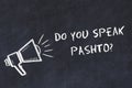 Learning foreign languages concept. Chalk symbol of loudspeaker with phrase do you speak pashto Royalty Free Stock Photo