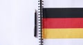 Learning foreign languages. Notepad for entries and a flag. Lang Royalty Free Stock Photo
