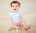 Learning is fun for a curious little boy. Full length shot of a cute baby boy playing with toy blocks. Royalty Free Stock Photo