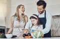 Learning, happy family or girl cooking or cutting vegetables in a kitchen with healthy food for dinner. Development Royalty Free Stock Photo