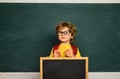 Learning at home. Kids gets ready for school. Happy mood smiling broadly in school. School and education concept. Royalty Free Stock Photo