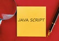 Learning JavaScript with sticky notes and writing tools on a red background for effective study and organization