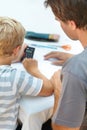 Learning, math and father help child with homework or homeschool as education and development in a home. Calculator